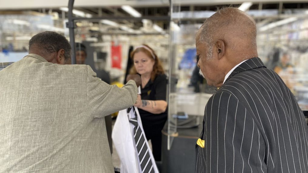 Veterans Melvin Woodard and Prince Rawlings drop off suits at Zips Cleaners in Maryland as a part of their non-profit, Helping Another Veteran Endure, which provides free suits to veterans in need. (Photo by Jay Korff/7News){p}{/p}