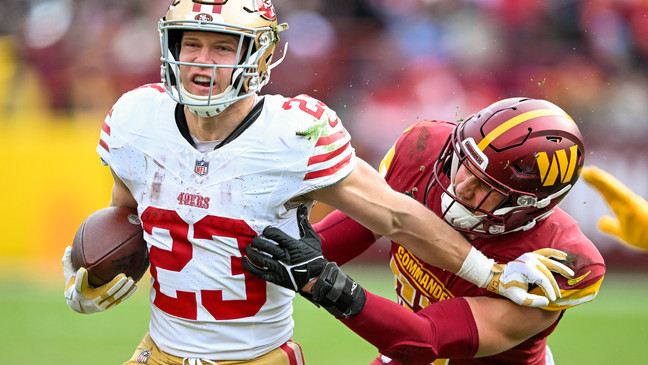 LANDOVER, MARYLAND - DECEMBER 31: Christian McCaffrey #23 of the San Francisco 49ers runs with the ball  during the second half of a game against the Washington Commanders at FedExField on December 31, 2023 in Landover, Maryland. (Photo by Greg Fiume/Getty Images)