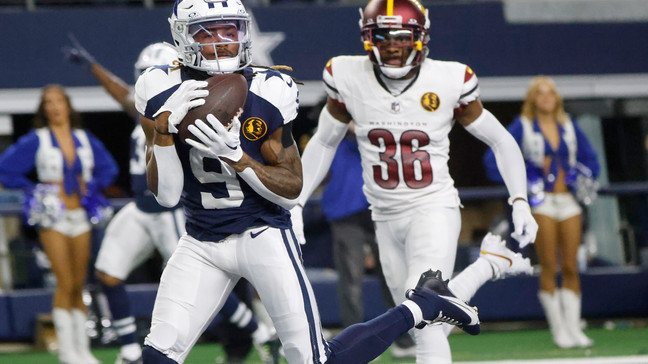 Dallas Cowboys wide receiver KaVontae Turpin (9) catches a touchdown pass in front of Washington Commanders cornerback Danny Johnson (36) during the second half of an NFL football game Thursday, Nov. 23, 2023, in Arlington, Texas. (AP Photo/Michael Ainsworth)