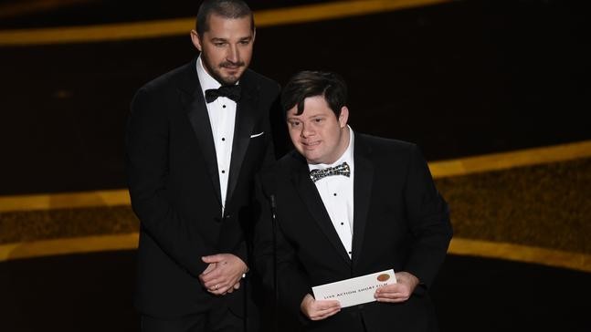 Shia LaBeouf, left, and Zack Gottsagen present the award for best live action short film at the Oscars on Sunday, Feb. 9, 2020, at the Dolby Theatre in Los Angeles. (AP Photo/Chris Pizzello)