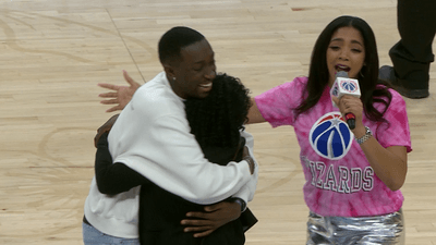 Image for story: SEE IT: Welcome home, Chase! On leave from Air Force, son surprises mom at Wizards game 